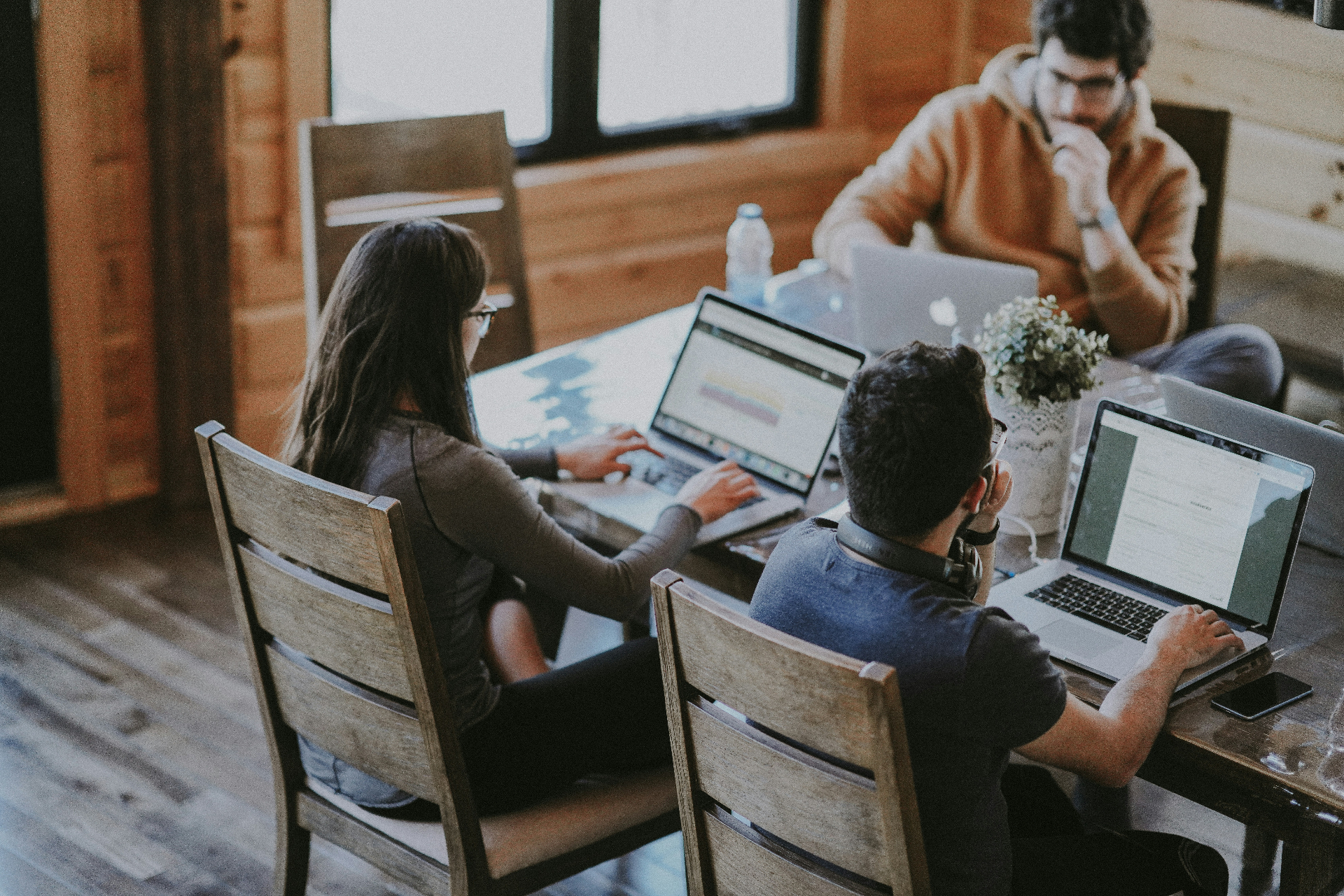 A team working together across laptops and shared systems